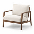 Fauteuil en tissu beige avec structure en bois de noyer