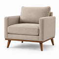 Fauteuil en tissu beige avec pieds en bois